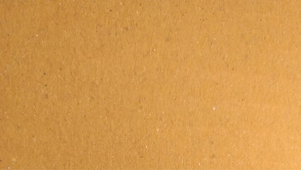Background of brown kraft paper or cardboard texture. Abstract pattern of beige rough carton, old paper sheet.