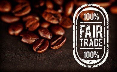 Roasted coffee beans piling on dark brown surface in 3D render, highlighting 100% fair-trade stamp