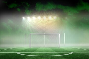 Football pitch under spotlights