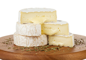 Isolated Brie Cheese Pieces Stacked on Wooden Cutting Board