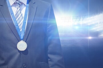 Midsection of businessman wearing medal