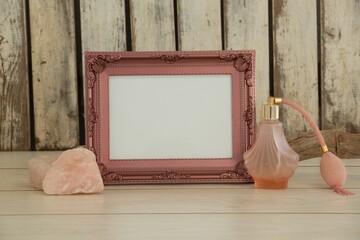 Photo frame and camera on table