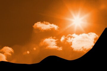 Bright sun with starburst flare is shining over dune silhouette against orange sky in flat design © vectorfusionart