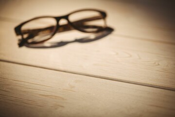 Black colored eyeglasses on table