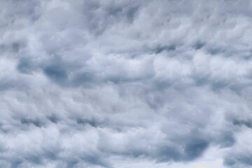 Stratocumulus cloud mass is filling frame in flat design style, featuring layered gray shapes