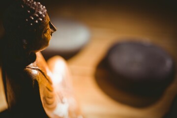 Buddha statue and pebbles