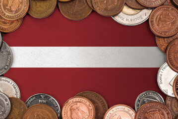 Coins on flag of Latvia trading investment business currency concept
