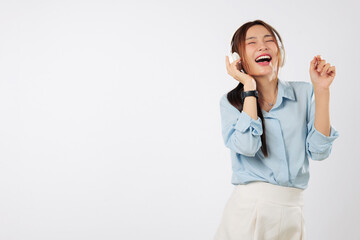 Music touches her soul while Asian woman listens happily, letting music enhance her smile, People lifestyle, and inner peace. isolated studio white background