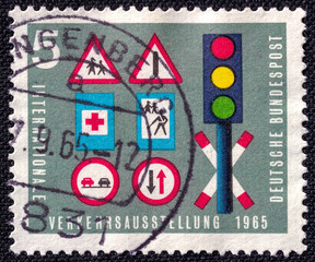 Road signs on a 1965 Germany vintage postage stamp