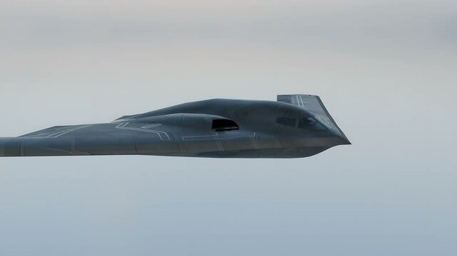 The B-2 Spirit stealth bomber is flying in the sky on a secret mission.