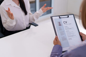 Job Interview Resume Review with Asian Woman Candidate Recruiter Analyzing CV for Accounting Position Career Opportunity Job Search and Skill Assessment