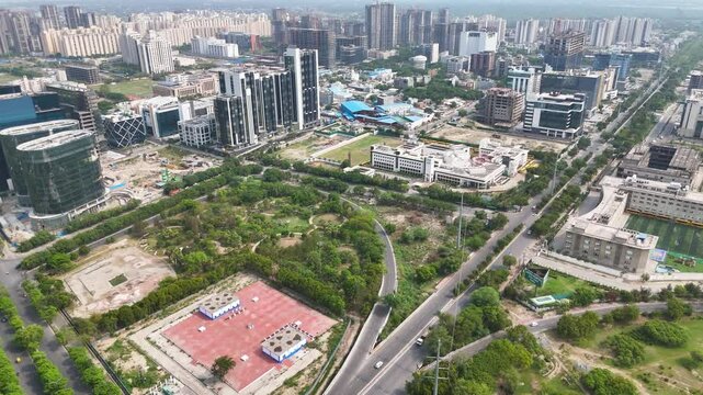 Top-down aerial shot revealing the geometric layout of roads and moving vehicles.