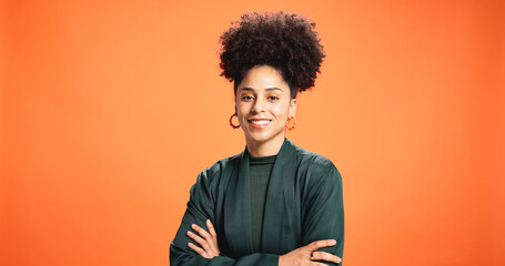 Obraz premium Portrait, woman and pride as designer in studio background for fashion, trendy clothes and bold style. African female person, space and arms crossed for aesthetic, outfit and jewellery as stylist