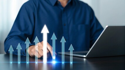 Businessman s hand interacting with glowing upward arrows representing business growth and financial success on a digital interface