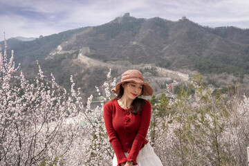 Woman enjoying view of great wall of China.