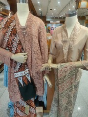 Elegant Mannequins Displaying Traditional Attire with Batik Patterns and Lace Detailing