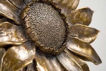 Detailed bronze sculpture of a sunflower.