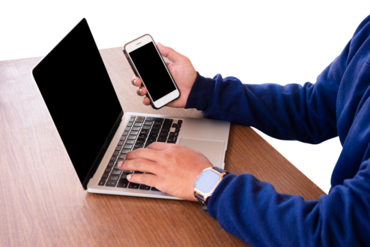 businessman using mobile phone and working on laptop