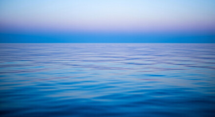 Obraz premium Tranquil sea fading into twilight sky