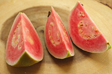 red guava fruit on wooden  background