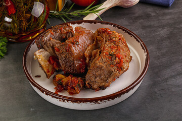 Baked beef ribs with vegetables