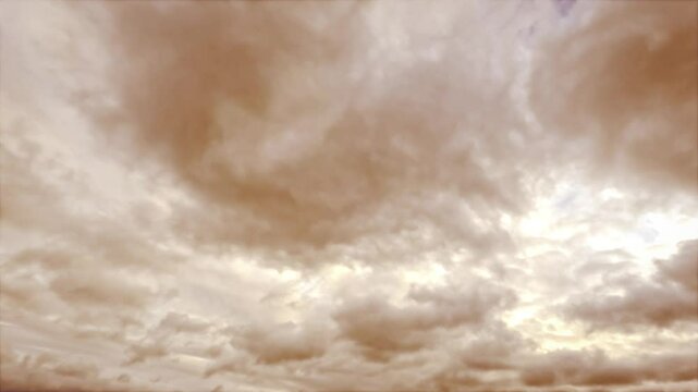 timelapse of heavy gloomy dirty orange snow or rain clouds