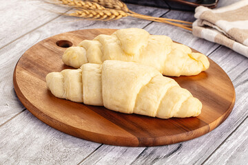 Raw uncooked croissant for bake