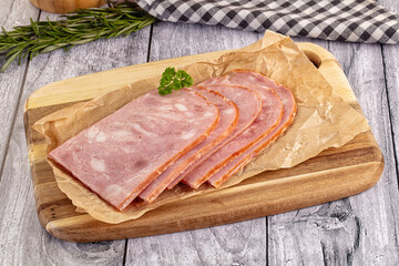 Sliced porjk ham over boatd