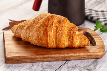 Fresh hot homemade croissant for breakfast