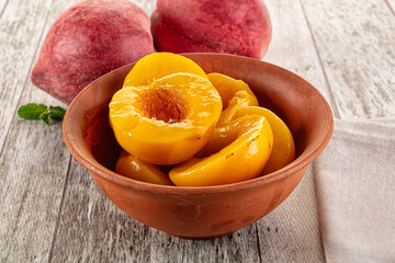 Sweet ripe yellow canned peaches
