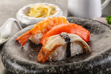 Japanese cuisine - sushi with eel, salmon and prawn