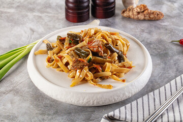 Asian cuisine udon with chicken and vegetables