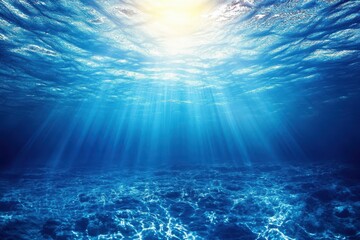 Underwater view of deep blue sea with vibrant sunlight filtering through the water, creating a serene and tranquil atmosphere ideal for aquatic exploration and relaxation