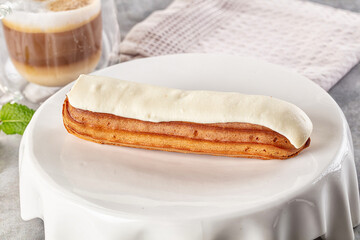 White vanilla eclair with icing