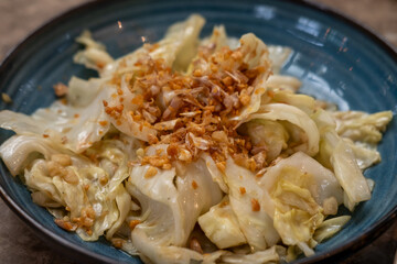 Thai stir fried cabbage with fish sauce, served on plate