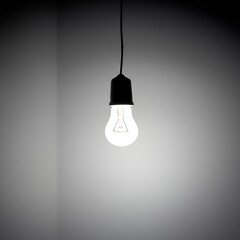 Single bare lightbulb hanging from wire in an empty room