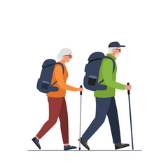 Active senior couple hiking with backpacks and trekking poles in nature  