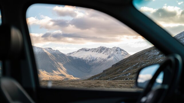 Breathtaking mountain view through car window with snow-capped peaks - Powered by Adobe