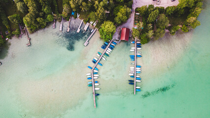 Aerial view over Wörthsee, beautiful lake with small docks in Bayern, Germany.