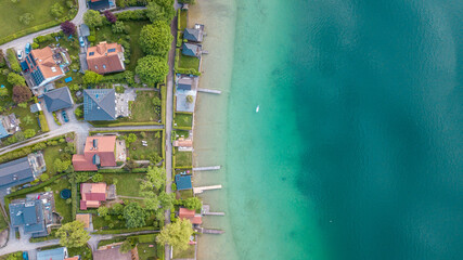 Aerial view over Wörthsee, beautiful lake with small docks in Bayern, Germany.