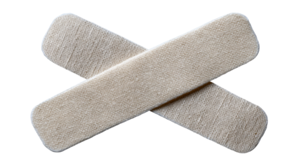 Two isolated adhesive bandages crossed on transparent background for medical use