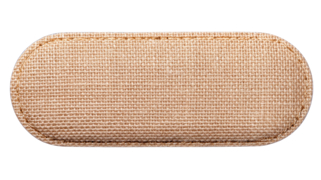 Isolated beige fabric patch on transparent background with stitched border and textured surface