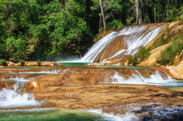 Close up of a cascade of the Agua Azul waterfalls in the rainforest of Chiapas, Palenque, Mexico.