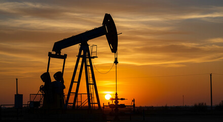 Silhouette of Oil Pump Jack at Sunset Energy Industry Extraction