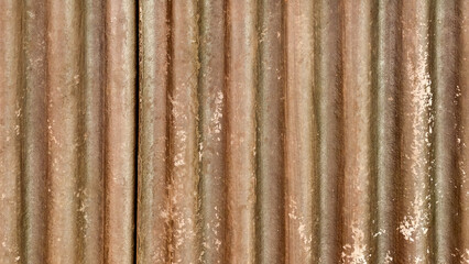 Aged corrugated metal backdrop presenting a weathered industrial texture and rustic charm