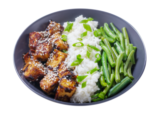 plate of fried tofu with sesame seeds, rice and green beans isolated on transparent background