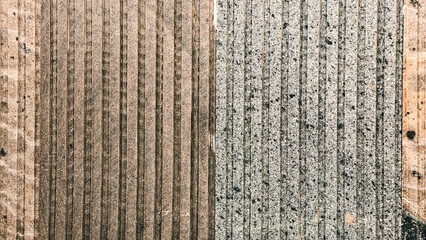 Distinct textures and parallel line formations on vintage surfaces create geometric artistry