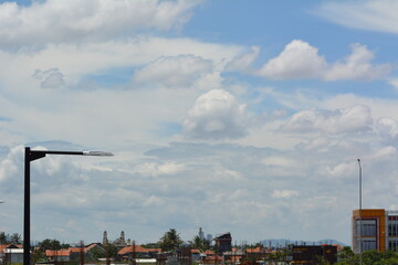 Photo OF The Bright Sunny Sky Over Rooftops