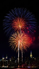 A Vibrant Display of Fireworks Illuminates the Night Sky Over a City Skyline, Creating a Spectacular Celebration of Light and Color Against the Dark Backdrop