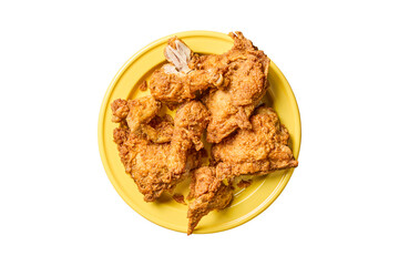 Crispy golden fried chicken pieces served on a bright yellow plate isolated on transparent...